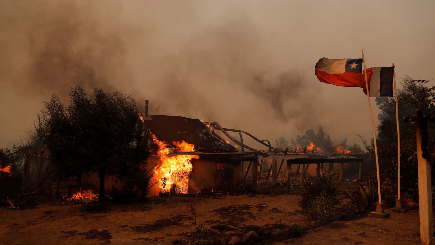 Flames consume a house during a fire in Santa Juana, Concepcion province, Chile on February 3, 2023.