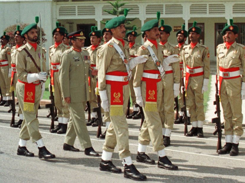 Musharraf, as Pakistan's newly appointed chief of army staff, inspects a military honor guard in Rawalpindi in 1998.