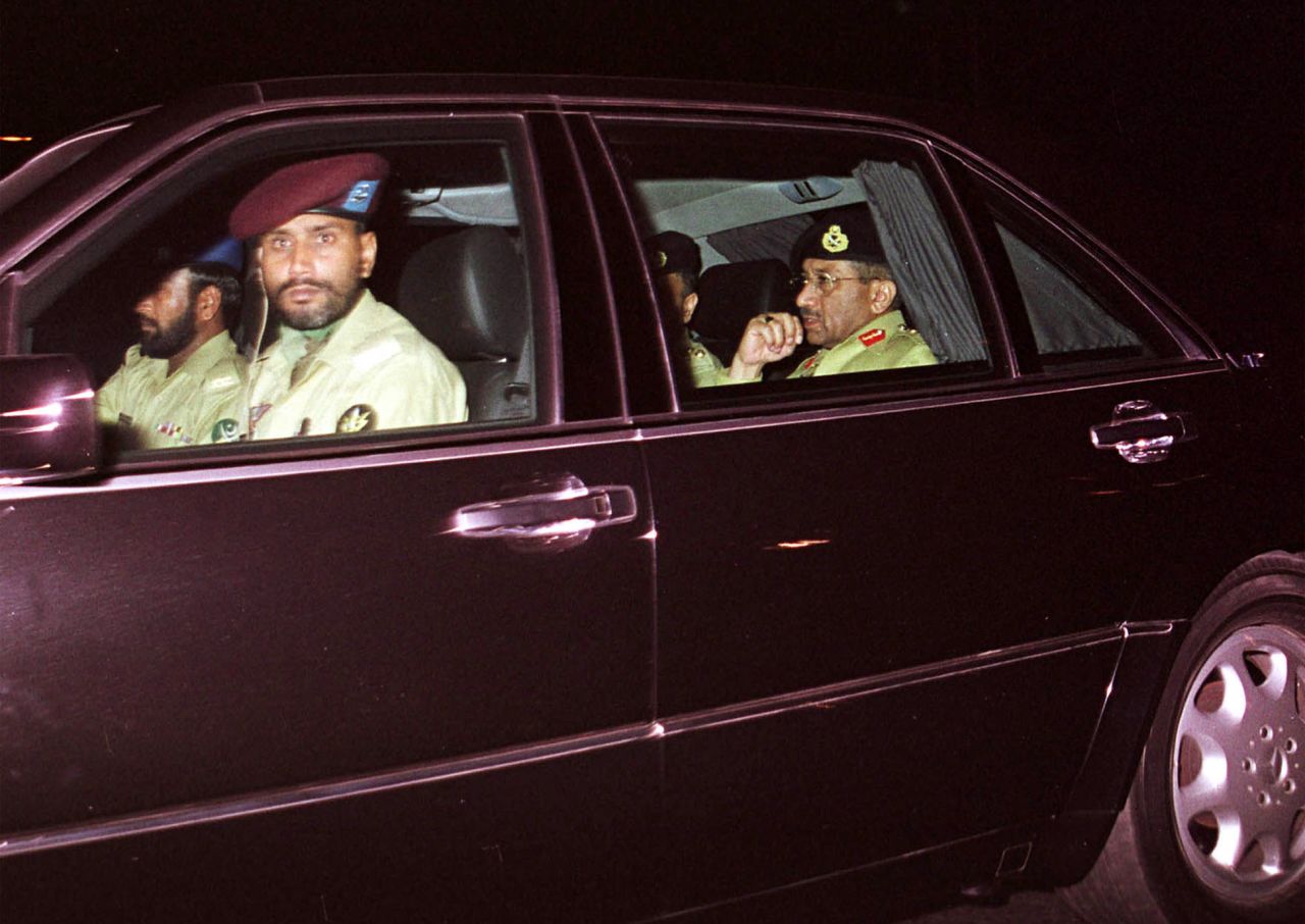 Musharraf, in the rear seat, arrives at the government television station in Islamabad, Pakistan, in October 1999 before addressing the nation. A week earlier, he led a coup against Prime Minister Nawaz Sharif and became head of government.