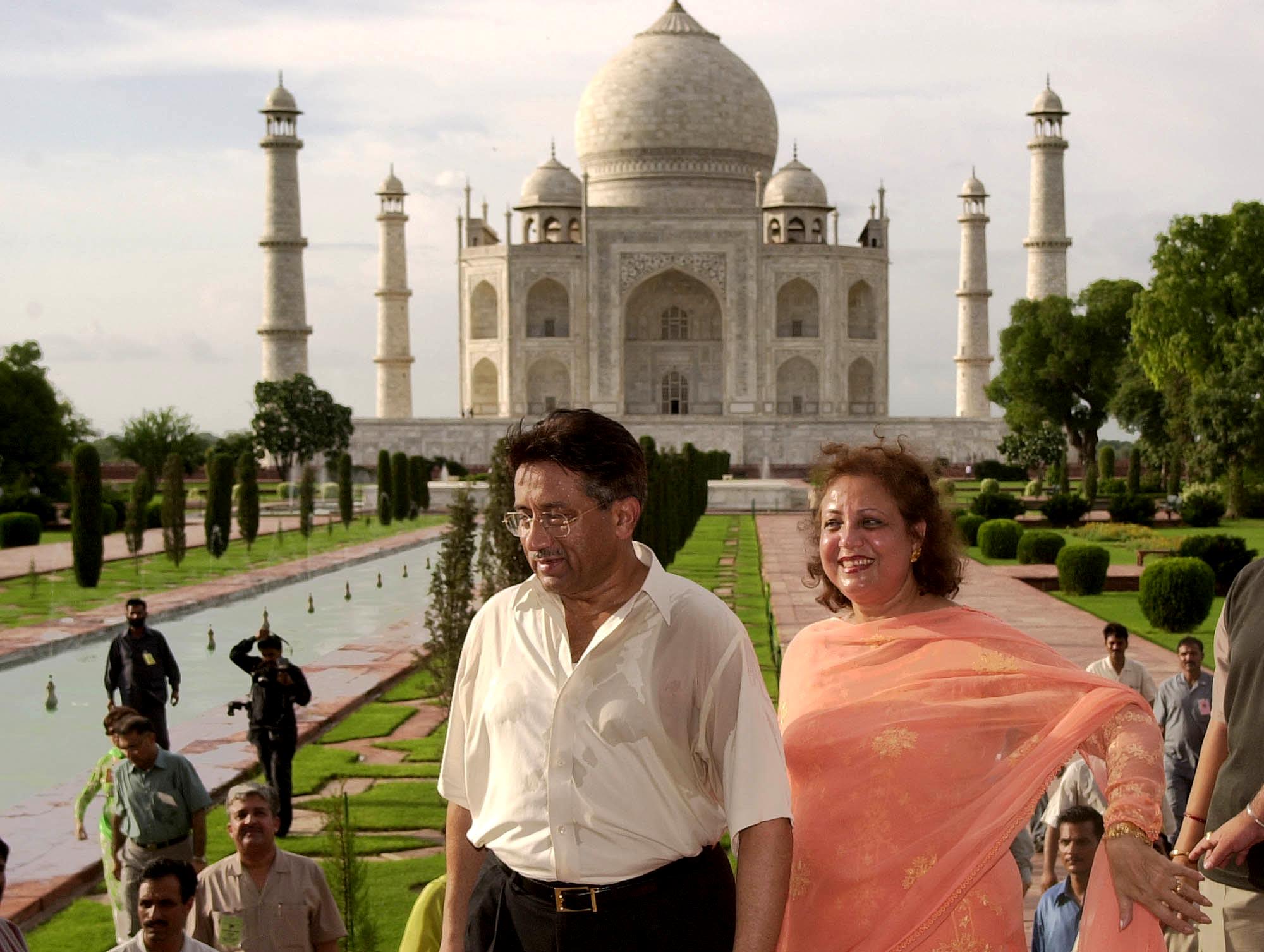 Musharraf and his wife, Sehba, leave the Taj Mahal in Agra, India, after a tour in July 2001.