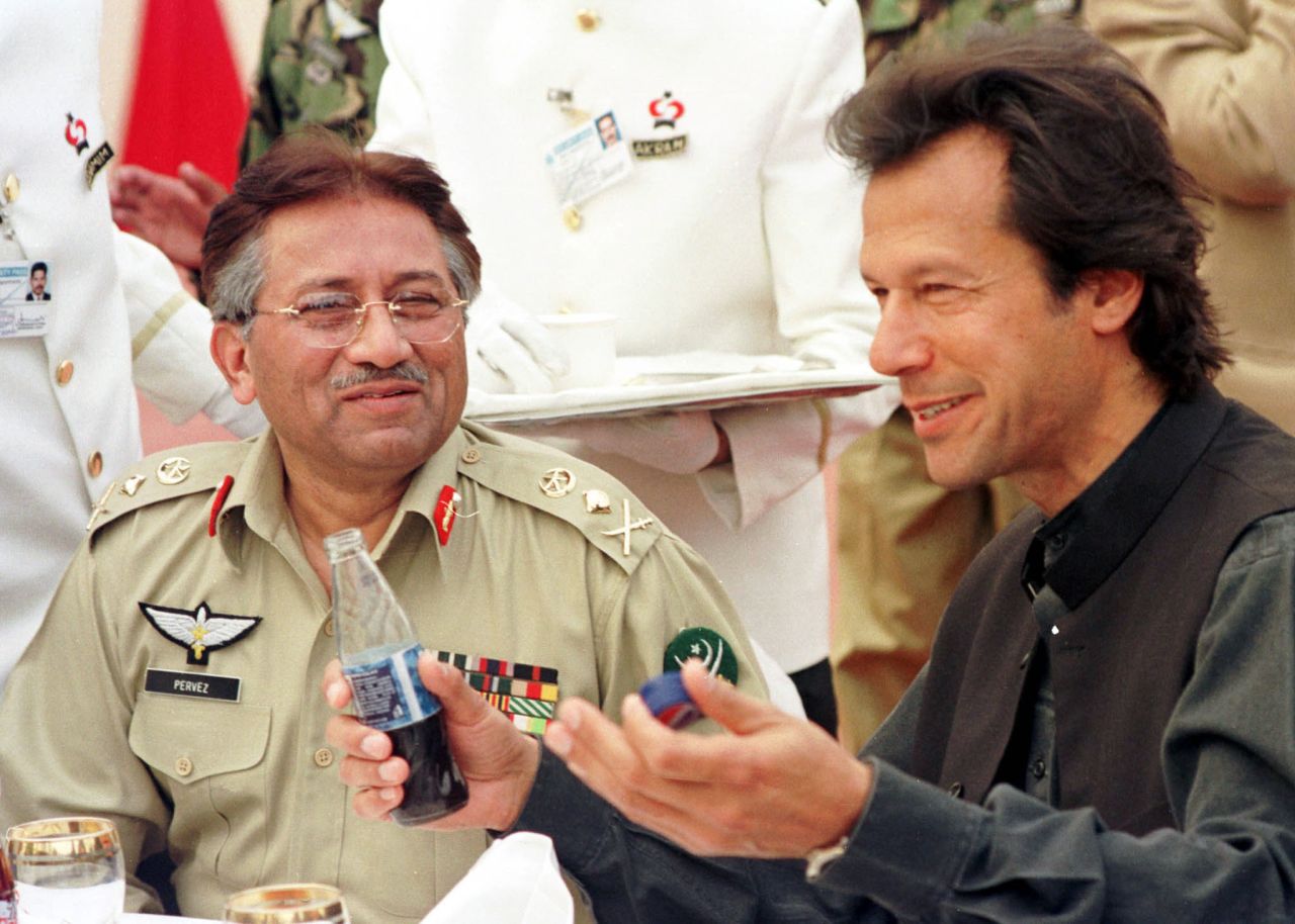 Musharraf and politician Imran Khan talk at a charity fundraising function in Lahore, Pakistan, in February 2002. Musharraf vowed to crack down on Islamic extremists in Pakistan, but attacks in India and the kidnapping of American journalist Daniel Pearl raised concern about a possible backlash.