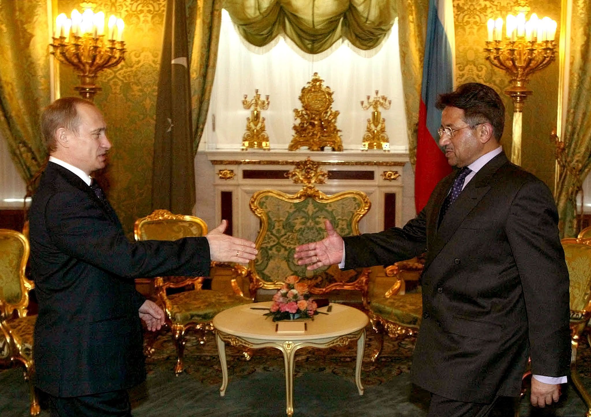 Musharraf meets with Russian President Vladimir Putin in Moscow in February 2003.