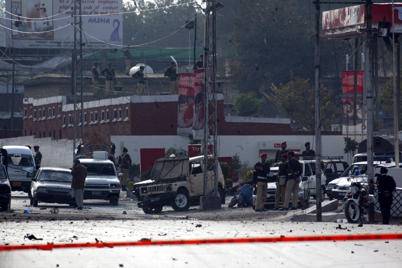 Pakistani soldiers stand guard in Rawalpindi after there were suicide bomb blasts on Musharraf's motorcade in December 2003. Musharraf escaped unharmed, but more than a dozen people were killed in the attack and more were wounded. There were two assassination attempts against Musharraf that month.