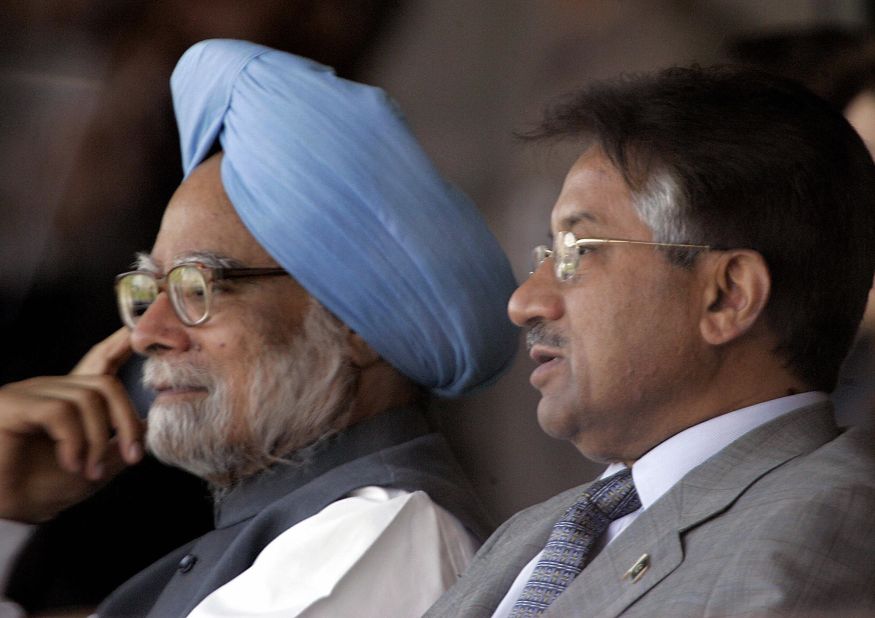 Musharraf sits next to Indian Prime Minister Manmohan Singh while watching a cricket series between India and Pakistan in 2005.