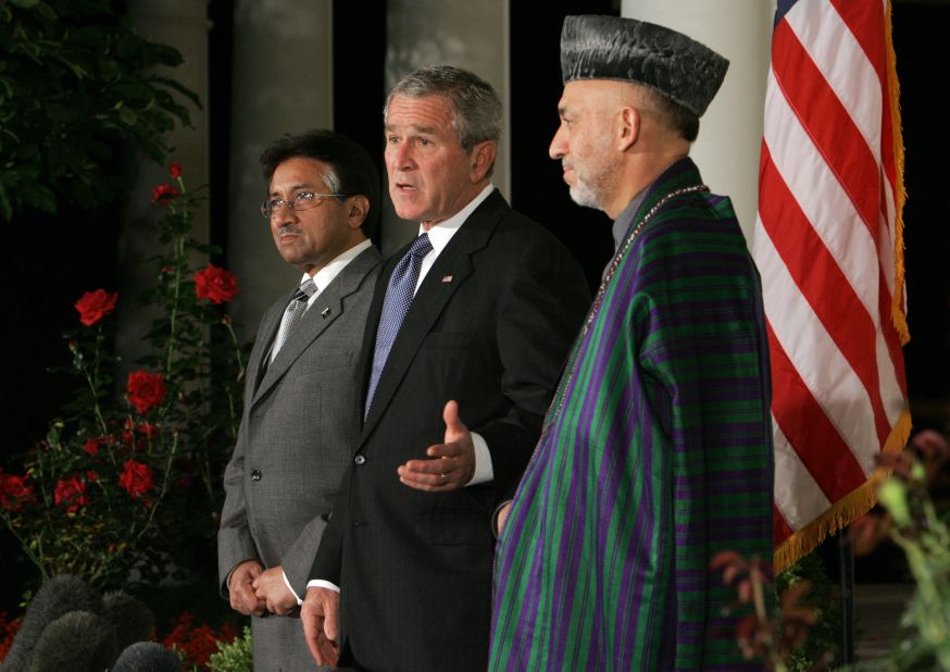 Bush speaks beside Musharraf and Afghan President Hamid Karzai after a White House meeting in September 2006.