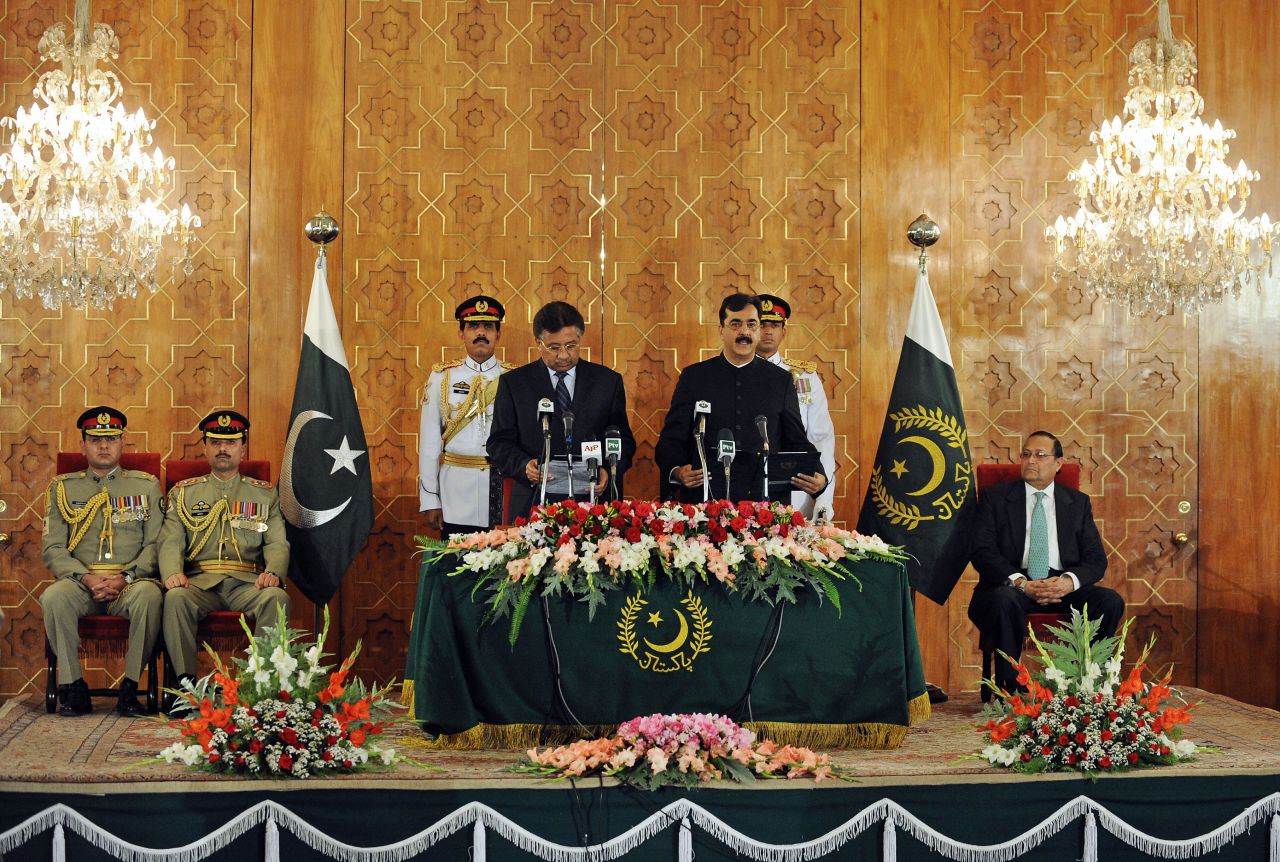 Musharraf administers the oath to newly elected Pakistani Prime Minister Yousuf Raza Gilani during a ceremony in Islamabad in March 2008. Under pressure from the West, Musharraf lifted the state of emergency and called elections a month earlier; his party fared badly.