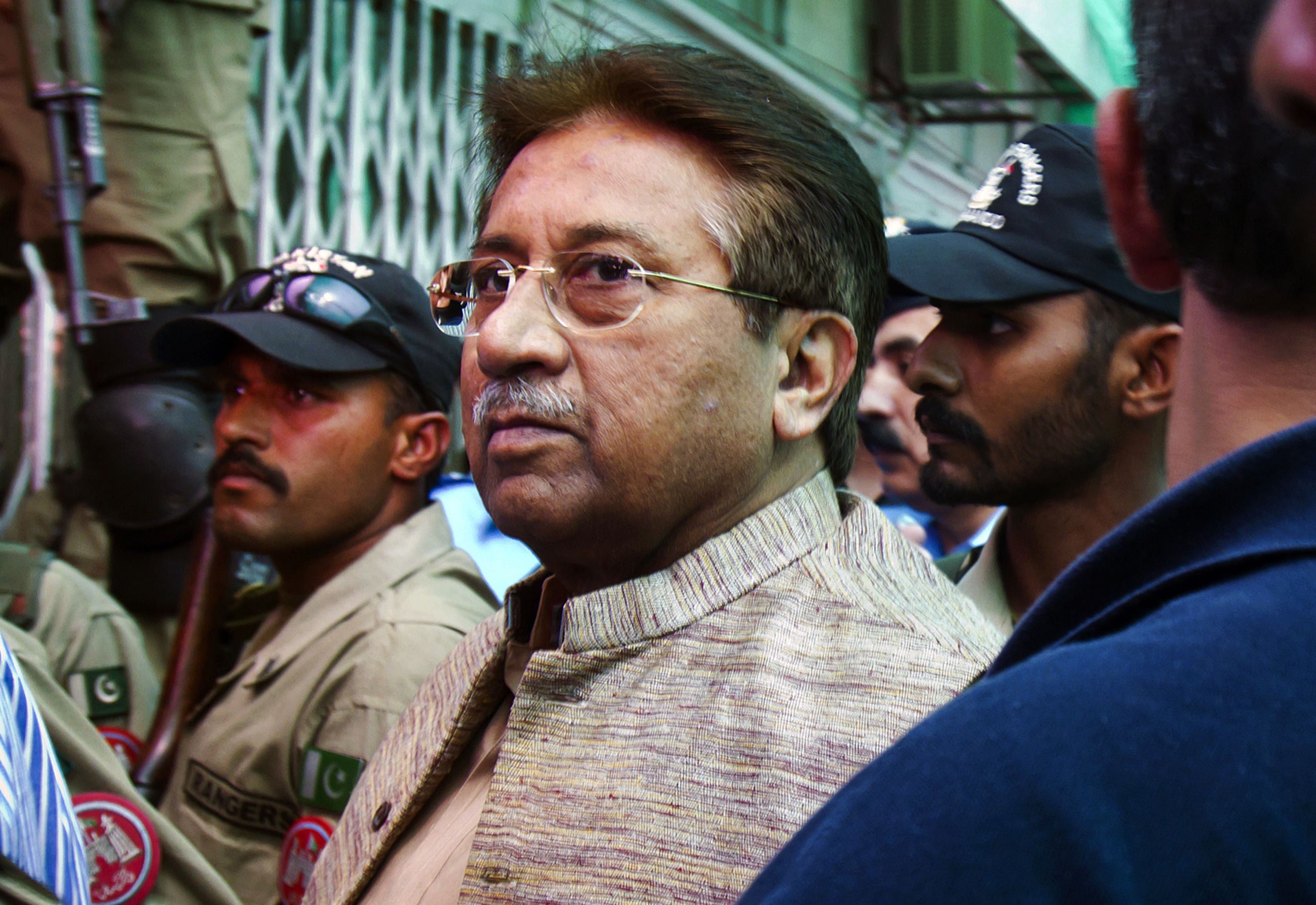 Musharraf arrives at an anti-terrorism court in Islamabad in April 2013.