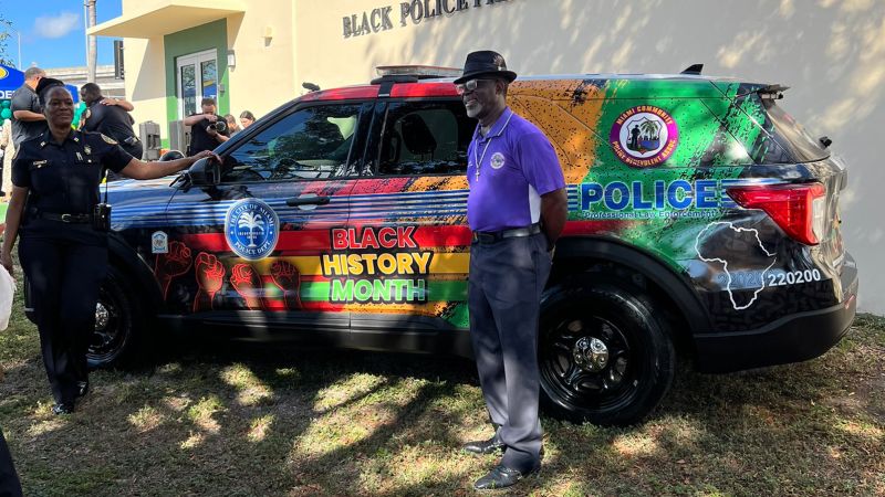NextImg:Miami police unveil Black History Month-inspired vehicle wrap featuring pan-African colors and kente cloth | CNN