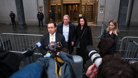 Charles McGonigal, the former head of counterintelligence for the FBI's New York office, (2nd L) listens as his attorney Seth Ducharme gives a statement outside Manhattan Federal Court, January 23, 2023.
