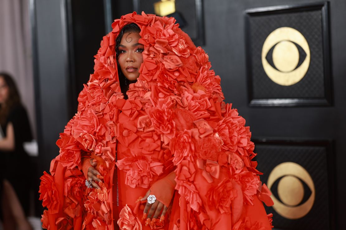 Lizzo wore a dramatic Dolce & Gabbana cape with floral appliques from the label's Alta Moda 2022 collection.