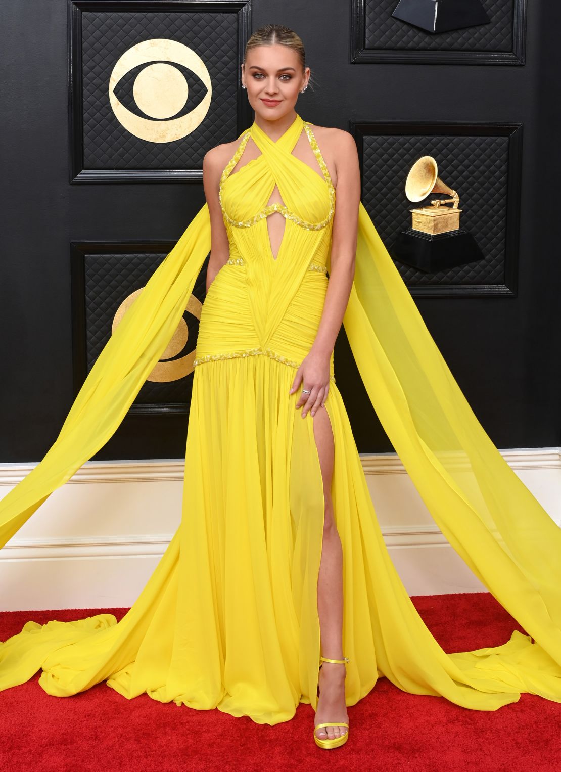 Country singer Kelsea Ballerini brought a pop of color to the red carpet in a custom Prabal Gurung gown. 
