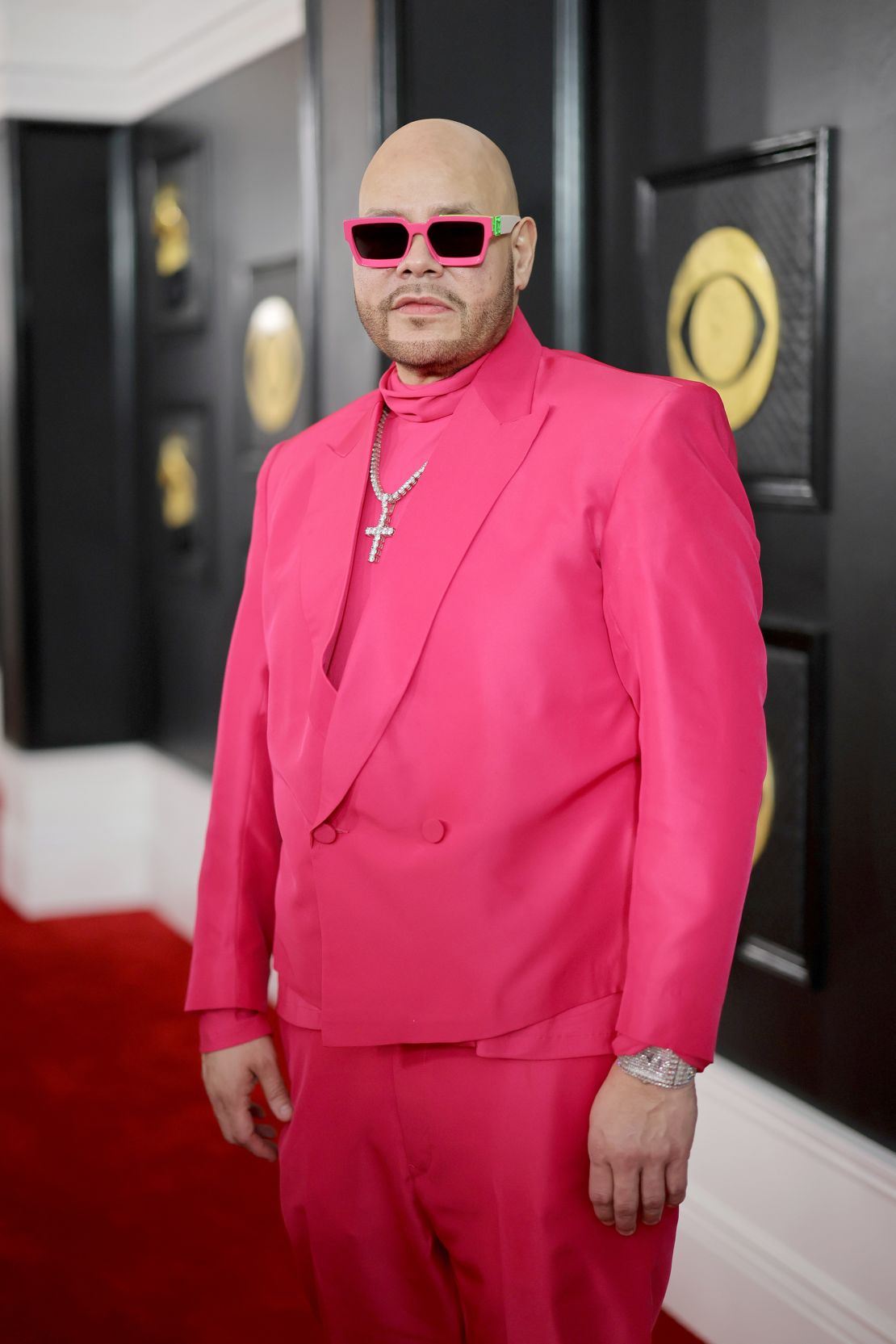 Fat Joe in a pink suit with matching shades.