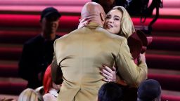 Adele finally meets Dwayne "The Rock" Johnson at the 65th Grammys.