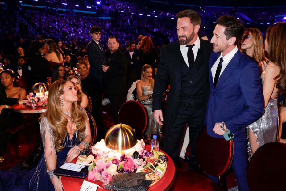 From left, Jennifer Lopez, Ben Affleck and Adrien Brody attend the show. <a href="https://www.cnn.com/entertainment/live-news/grammy-awards-2023/h_941ccab490a19cd7fd10ba5cab9449e7" target="_blank">See more photos from behind the scenes</a>.