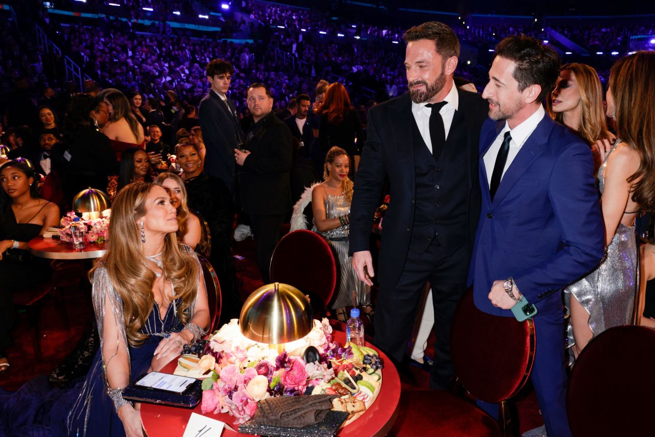 From left, Jennifer Lopez, Ben Affleck and Adrien Brody attend the show. <a href=