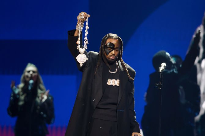 Quavo <a href="index.php?page=&url=https%3A%2F%2Fwww.cnn.com%2Fentertainment%2Flive-news%2Fgrammy-awards-2023%2Fh_0d4ac4e348a30cdf2fcf223e840994de" target="_blank">pays tribute to fellow Migos member Takeoff</a> during the "in memoriam" segment on Sunday night. Takeoff was killed in Houston three months ago.