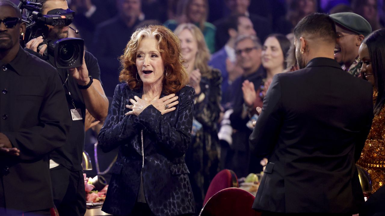 Bonnie Raitt looked stunned when her win for "Just Like That" was announced at the 65th annual Grammy Awards ceremony in Los Angeles on Sunday, February 5.
