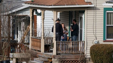 An Ohio state trooper tells residents to evacuate Sunday in East Palestine, Ohio.