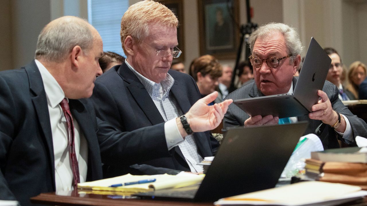 Alex Murdaugh, center, speaks with his defense attorneys during his trial in Walterboro, South Carolina, on Friday, February 3, 2023. 
