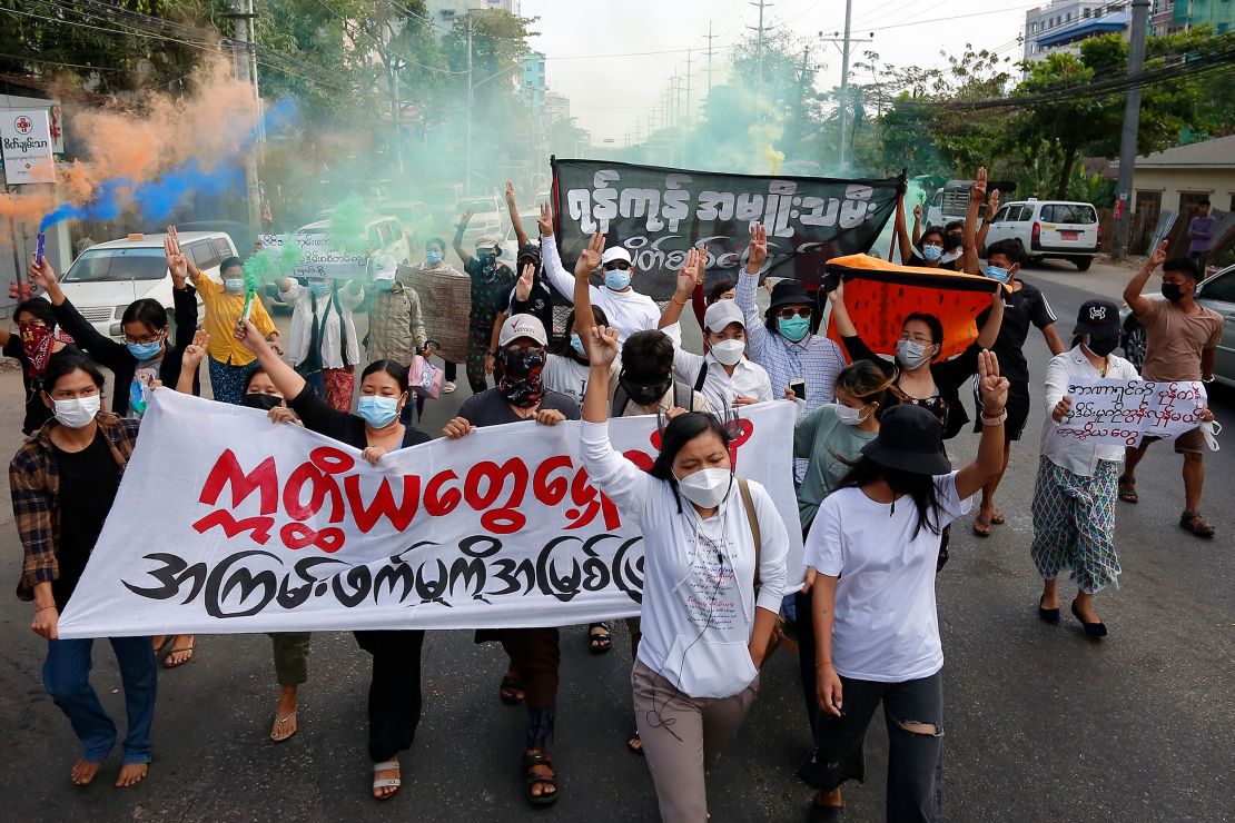 Anti-coup protesters march in Yangon, Myanmar on March 8, 2022 to mark International Women's Day.