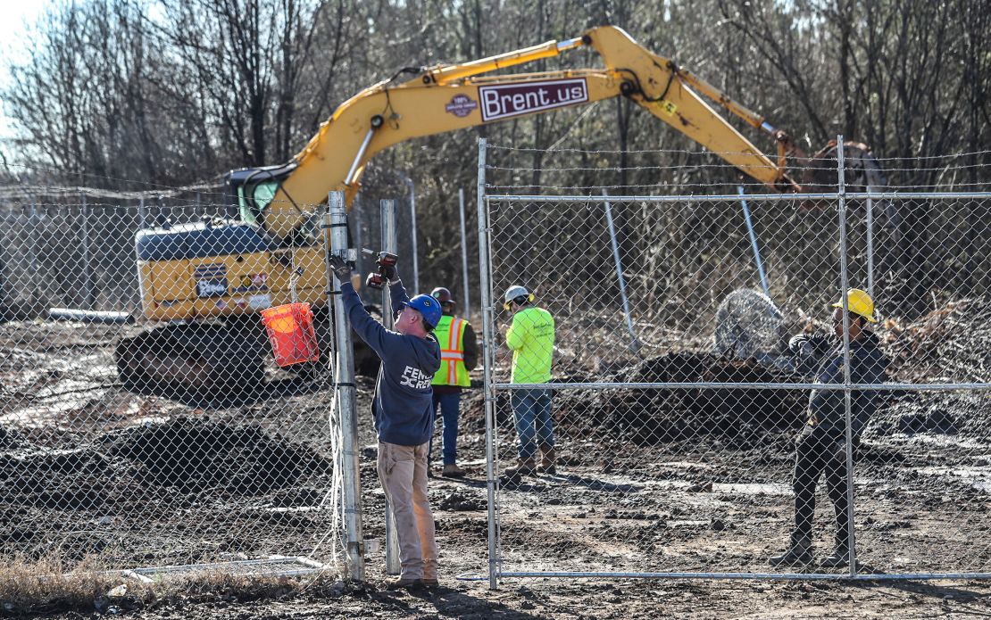Law enforcement and construction crews were seen on Monday at the future site of the $90 million police training facility.