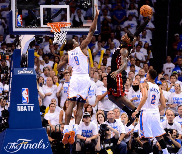 James dunks over Serge Ibaka during Game 2 of the Finals in June 2012. The Heat went on to win in five games, giving James his first NBA title.