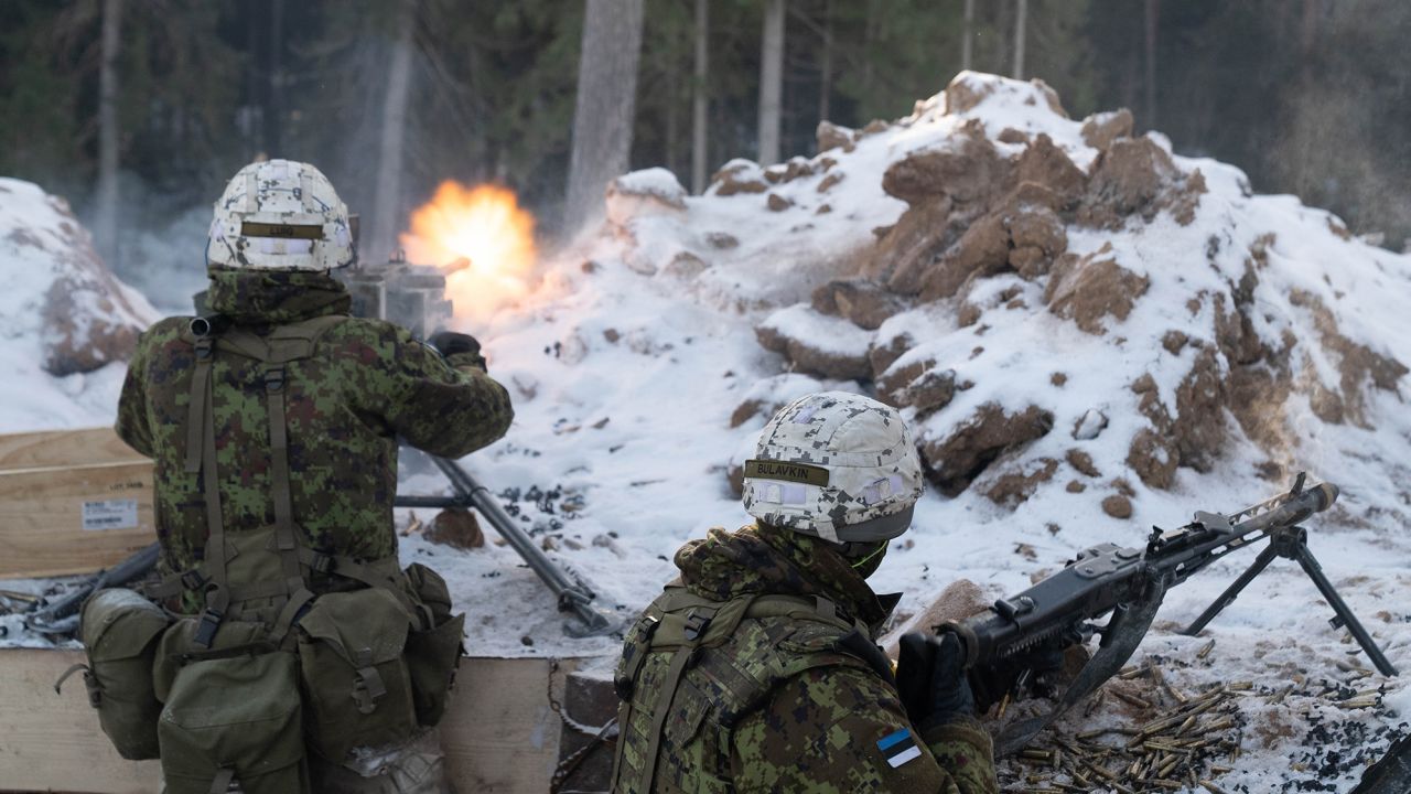 Estonian troops fire at French mountain commandos attacking their position as part of a NATO exercise in Estonia. 