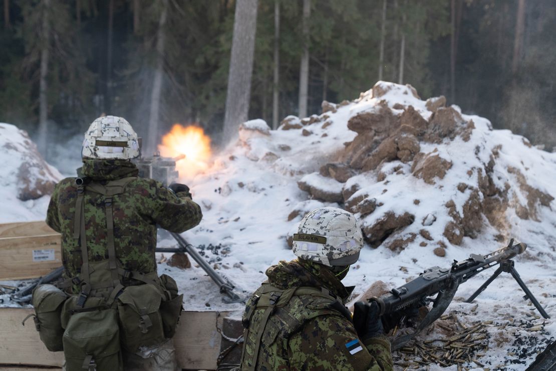 Estonian troops fire at French mountain commandos attacking their position as part of a NATO exercise in Estonia. 