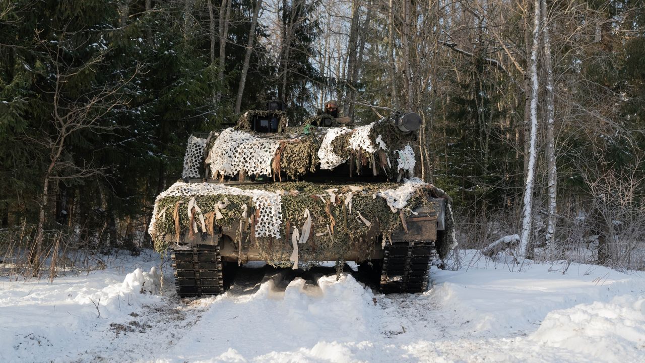 A Danish Leopard 2 tank prepares to support French commandos as they attack a position in a NATO exercise in Estonia.