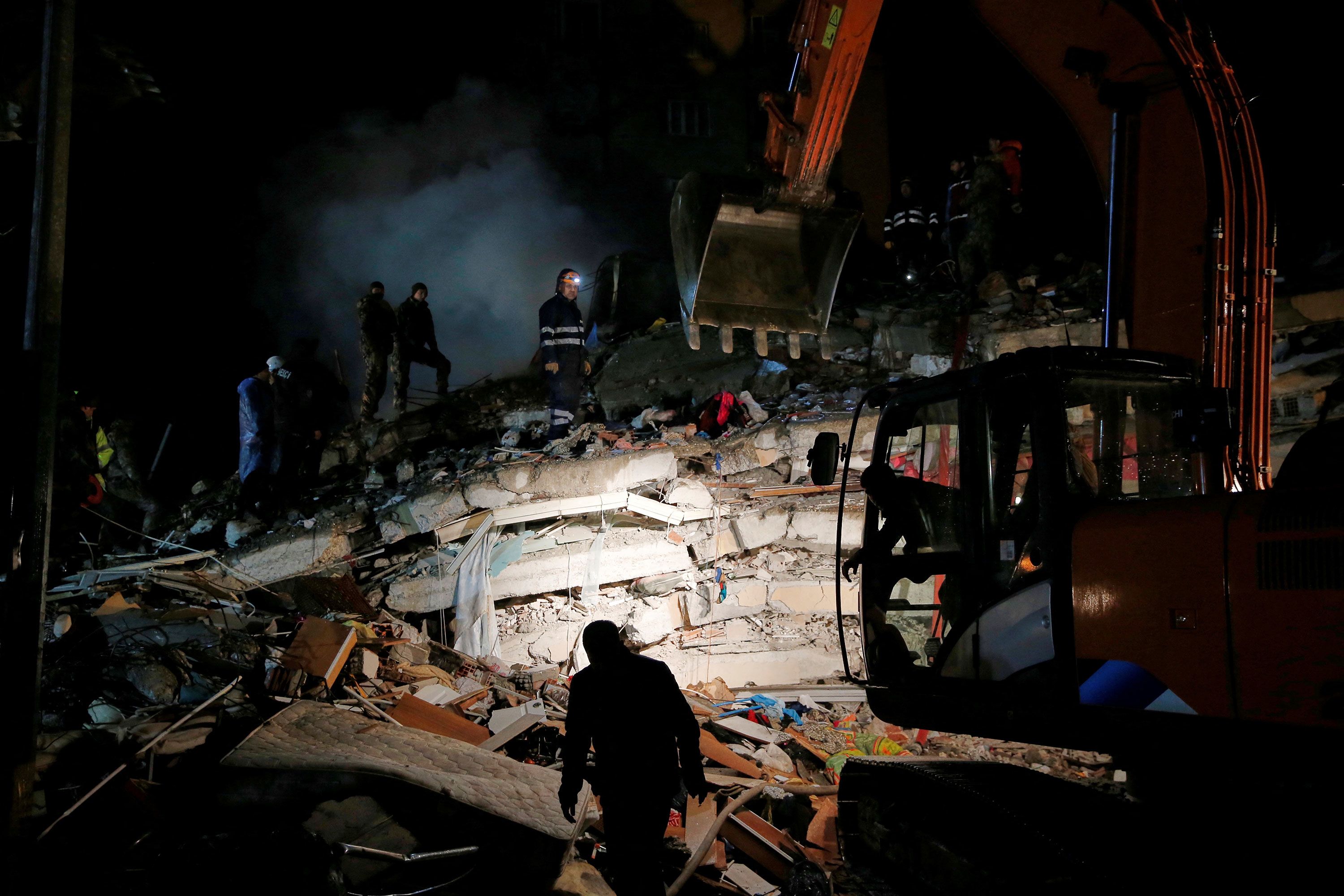 Rescue workers save people from a building fire in Pakistan