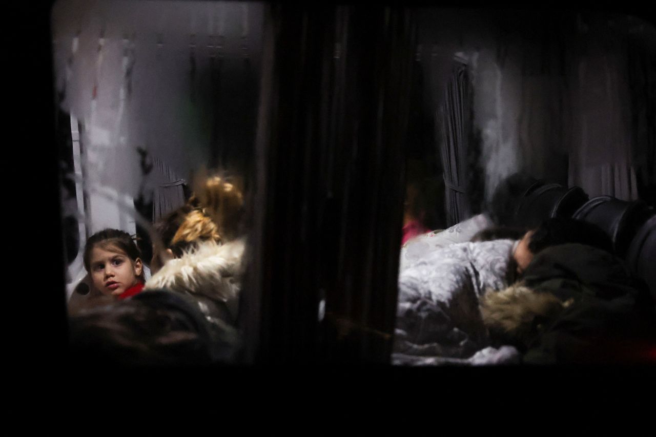 A child looks out from a bus where people were sleeping in Antakya, Turkey, on February 6.