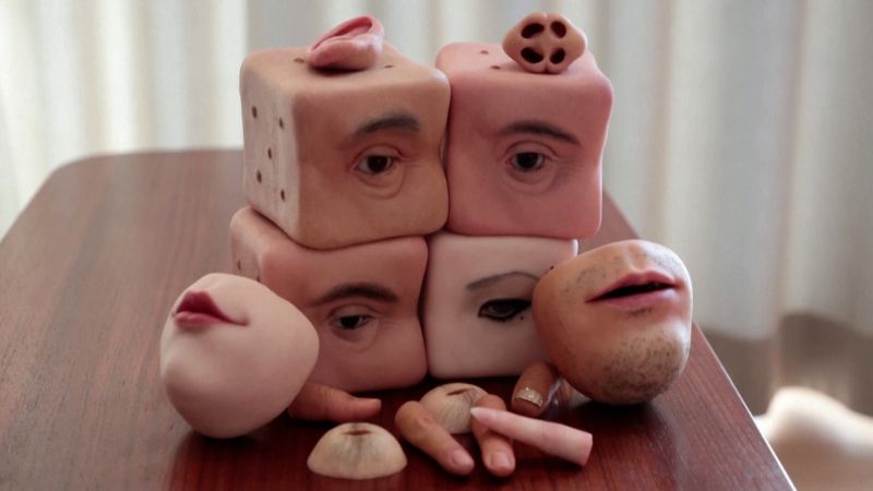From mouth purses to blinking eye dice, this artist creates flesh-like accessories | CNN Business