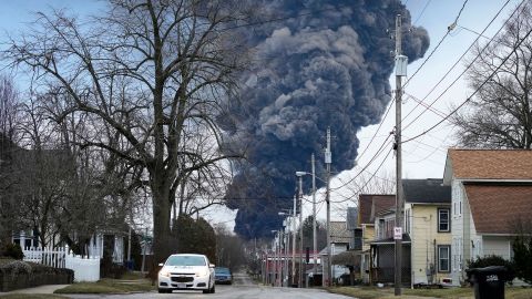 A black plume rises over East Palestine, Ohio, as a result of a controlled detonation on a derailed train Monday, February 6, 2023. 