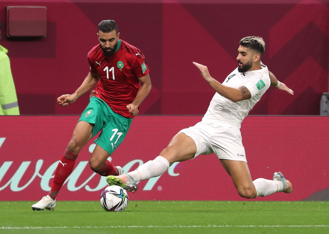 Morocco's Ismail El Haddad and Palestinian Yaser Hamed contest the ball in an Arab Cup game in December 2021.