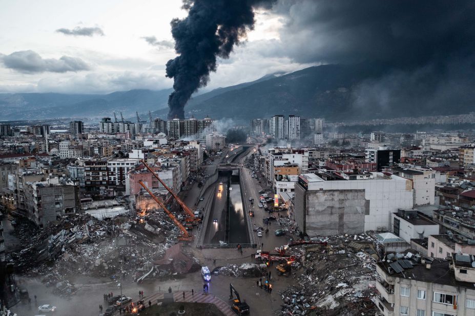 Smoke billows from the port in Iskenderun as emergency workers continue rescue efforts on February 7.