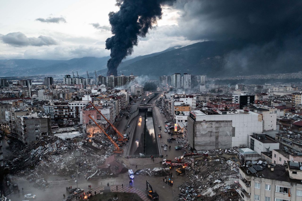 Smoke billows from Iskenderun Port as emergency workers continue rescue efforts in the aftermath of the earthquake in Iskenderun, Turkey, on Tuesday.