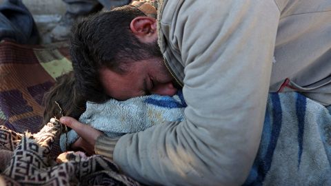 A Syrian man cries over the body of his lifeless child in the rebel-held town of Jindiris on Tuesday.