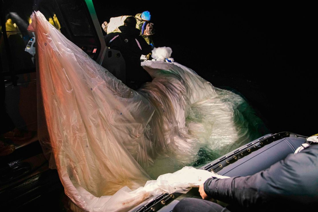 Sailors assigned to Explosive Ordnance Disposal Group 2 recover a high-altitude surveillance balloon off the coast of Myrtle Beach, South Carolina, Feb. 5, 2023. (U.S. Navy)