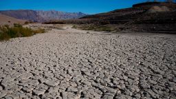 Cracked earth is visible in an area once under the water of Lake Mead at the Lake Mead National Recreation Area, Friday, Jan. 27, 2023, near Boulder City, Nev. (AP Photo/John Locher)