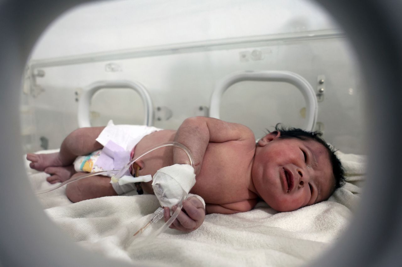 A baby girl who was <a href="https://www.cnn.com/2023/02/06/world/gallery/earthquake-turkey-syria-2023/index.html" target="_blank">reportedly rescued from the rubble of her family's earthquake-damaged home</a> receives treatment at a hospital in Afrin, Syria, on Tuesday, February 7. Her umbilical cord was still attached to her mother when she was found, <a href="https://www.france24.com/en/live-news/20230207-syria-newborn-pulled-alive-from-quake-rubble" target="_blank" target="_blank">a relative told Agence France-Presse</a>. Her mother is believed to have died after giving birth.