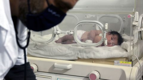 A baby girl who was born amid the rubble caused by Monday's earthquake, seen inside an incubator at a children's hospital in the town of Afrin, Aleppo province, Syria, Tuesday, Feb. 7, 2023. 