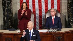 Vice President Kamala Harris stands and applauds as Speaker of the House Kevin McCarthy remains seated as President Joe Biden delivers his State of the Union address.