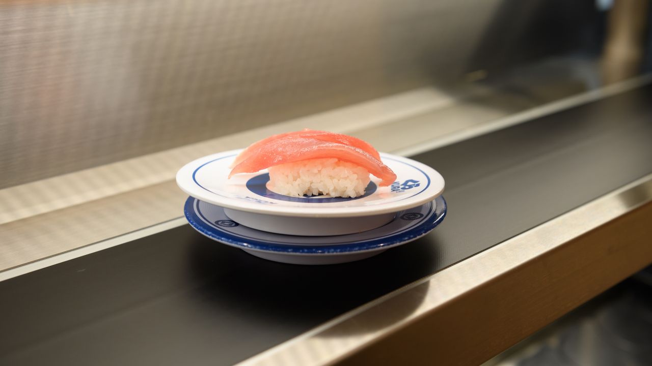 A plate of tuna sushi coming down a conveyor belt at Kura Sushi's Harajuku store in Tokyo, Japan in September 2022. 