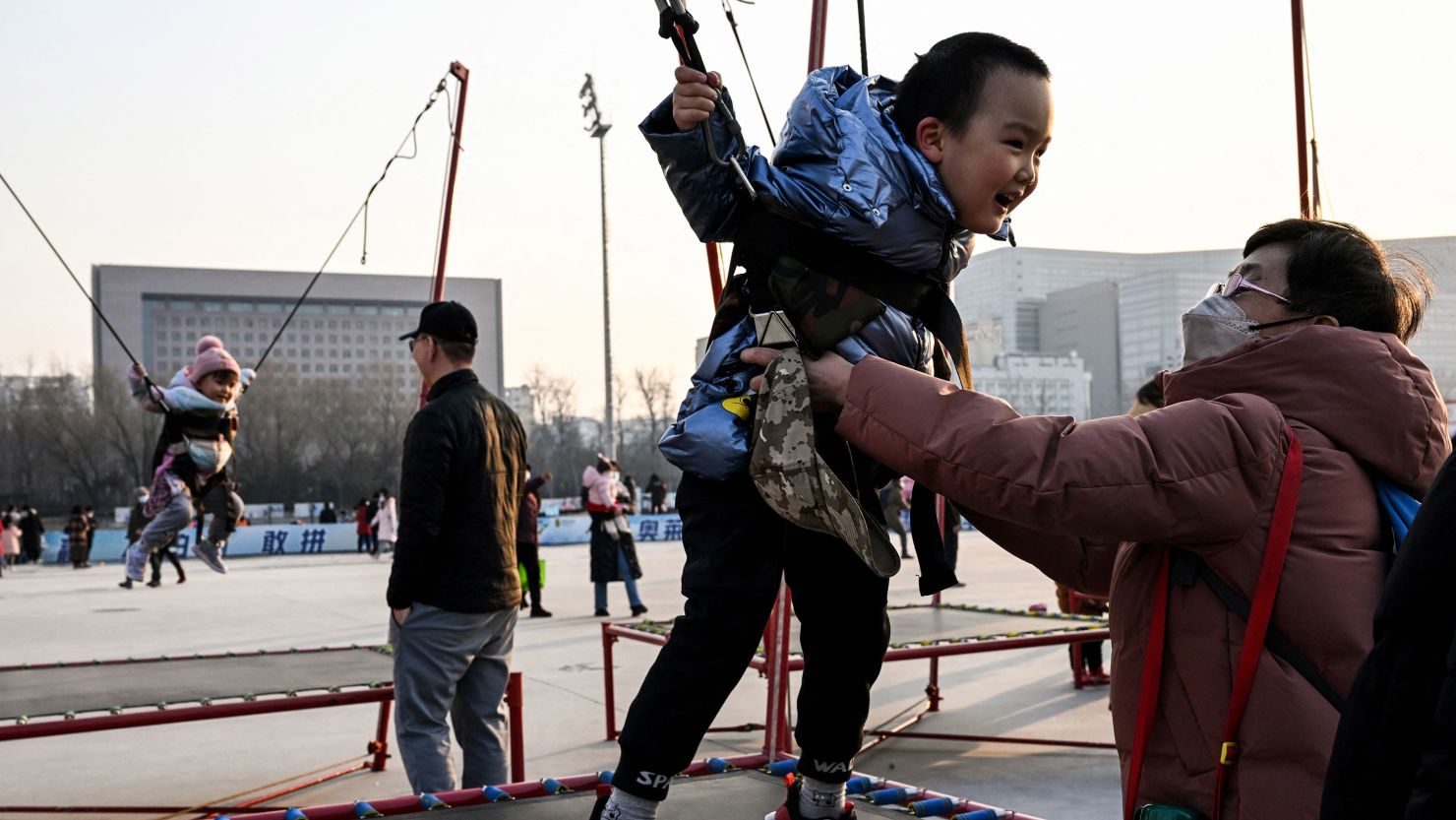 Children jump on trampolines in Beijing on February 5, 2023.