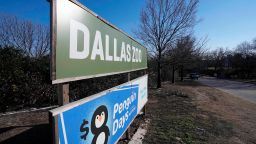 The Dallas Zoo sign welcomes visitors to the facility, Friday, Feb. 3, 2023, in Dallas. Zoo officials and representatives from the Dallas Police Department had a news conference at the Friday, announcing the arrest of a person in connection with missing animals from the zoo. (AP Photo/Tony Gutierrez)