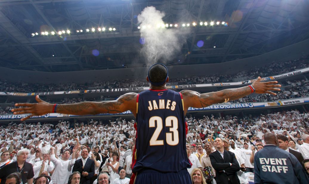 LeBron James does his chalk toss ritual before a game in 2008. Basketball players use chalk to help them grip the ball better.