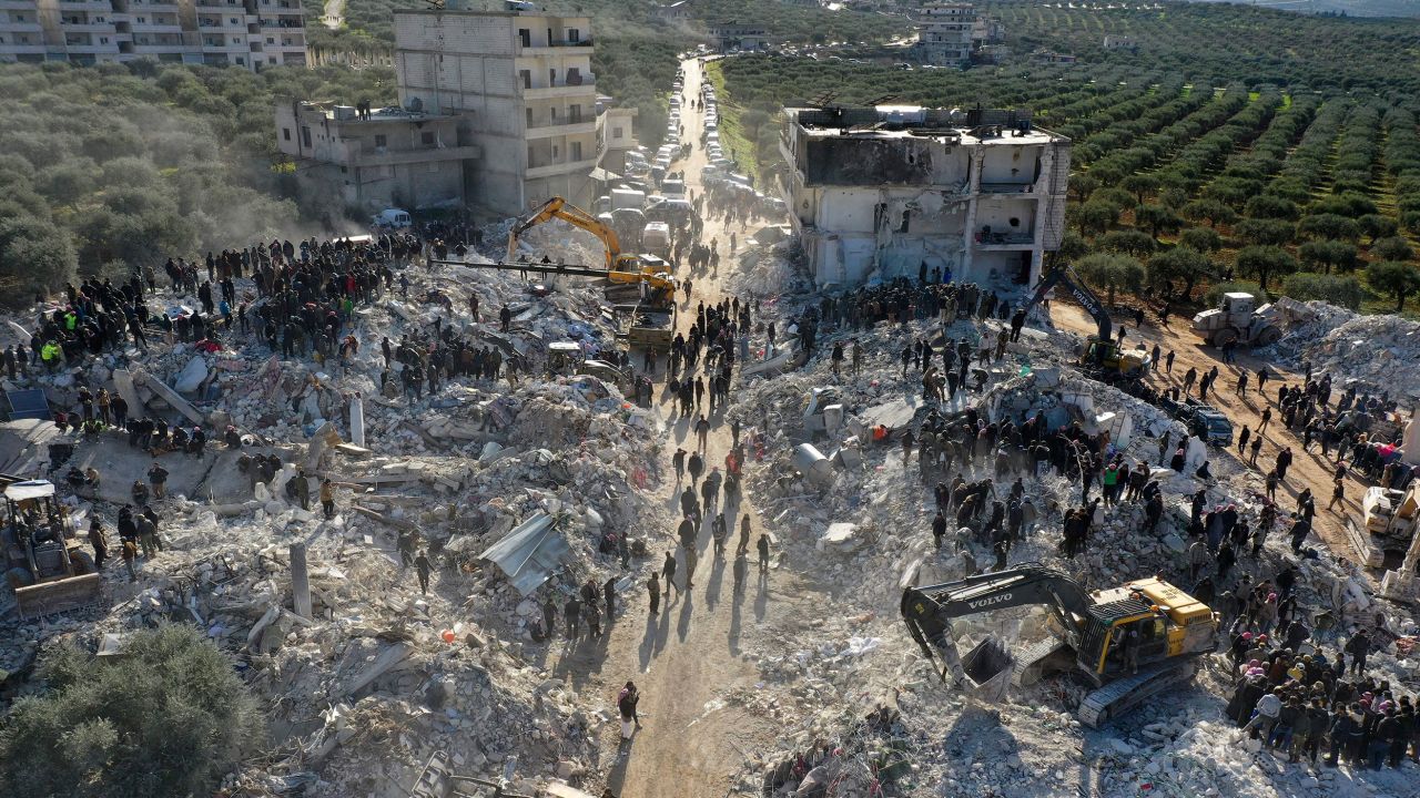 Rescuers search the rubble of buildings for casualties and survivors in the village of Besnaya in Syria's rebel-held northwestern Idlib province, at the border with Turkey.