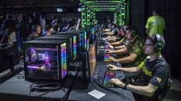 Attendees play a beta version of Overwatch 2 during the Activision Blizzard Inc. Overwatch League 'Battle For Texas' tournament at Tech Port Arena in San Antonio, Texas, U.S., on Friday, May 6, 2022. The 'Battle For Texas' tournament is the first in-person match since early 2020. 