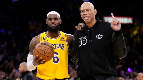 Los Angeles Lakers forward LeBron James, left, poses with  Abdul-Jabbar after passing him to become the NBA's all-time leading scorer on Tuesday.