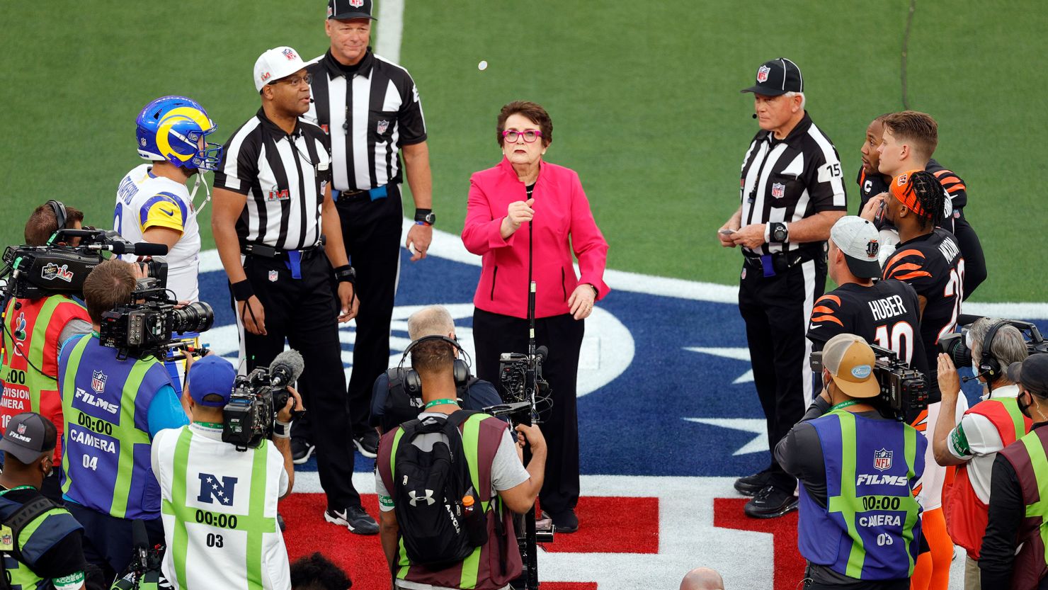 Billie Jean King performs the coin toss on the field with referee Ronald Torbert (62) before the NFL Super Bowl 56 football game between the Los Angeles Rams and the Cincinnati Bengals, Sunday, Feb. 13, 2022 in Inglewood, CA.